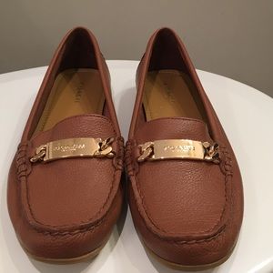 Coach tan loafer flats.